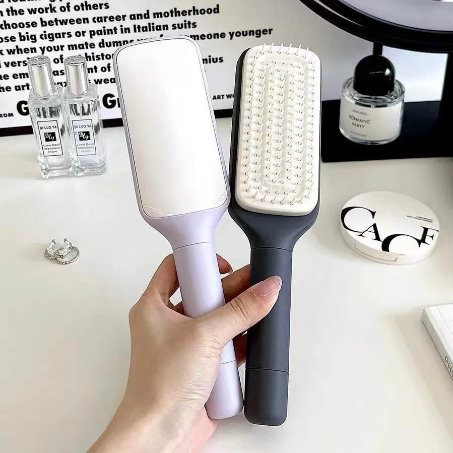 Brosse Démêlante à Manche Rotatif – Retrait Instantané des Cheveux