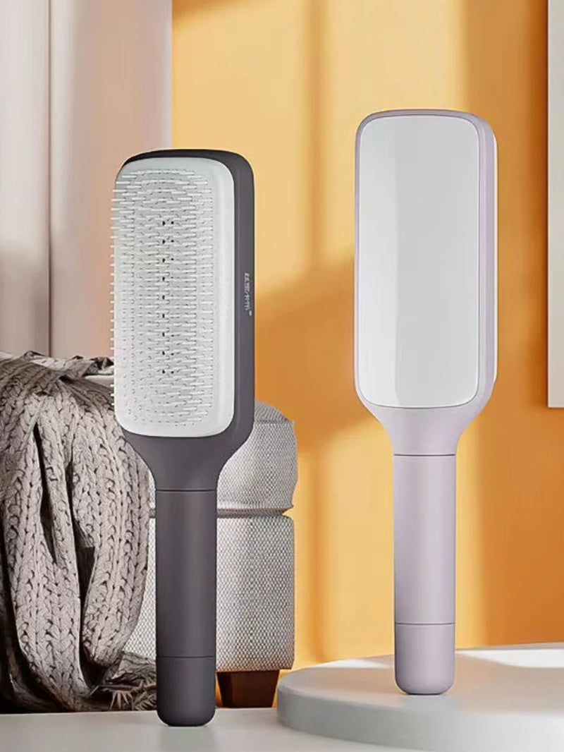 Brosse Démêlante à Manche Rotatif – Retrait Instantané des Cheveux